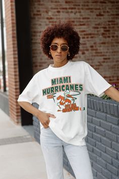 Whether you're cheering on your team from the sidelines or enjoying the festivities at the tailgate, our Spring Collection Game Day Essentials are sure to keep you looking and feeling fabulous all season long. Join the fashion game and make every game day unforgettable! From The Sidelines, Football Game Outfit, Michigan State Spartans, Oversized Crewneck, University Of Miami, Gameday Outfit, Michigan State, Gaming Clothes, Spring Collection