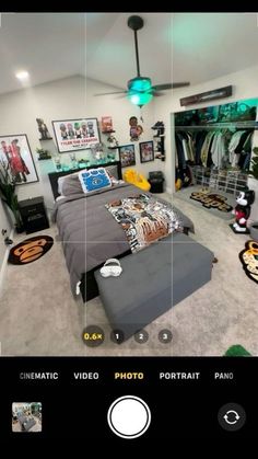 an image of a bedroom with pictures on the wall