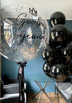 a bunch of balloons that are sitting on a table