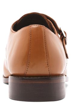 A cap-toe and double-monk strap add vintage-inspired appeal to this leather shoe balanced on a Goodyear welted sole. Leather upper, lining and sole Imported Asian Owned/Founded Brown Goodyear Welted Monk Strap Shoes For Business Casual, Timeless Brown Monk Strap Shoes With Leather Lining, Masculine Brown Plain Toe Monk Strap Shoes, Masculine Brown Monk Strap Shoes With Plain Toe, Classic Brown Monk Strap Shoes With Almond Toe, Business Casual Monk Strap Shoes With Rubber Sole, Brown Timeless Monk Strap Shoes With Almond Toe, Cognac Monk Strap Shoes With Round Toe For Business, Timeless Brown Monk Strap Shoes With Almond Toe