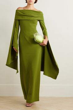 Solace London's 'Arden' dress has a draped off-the-shoulder neckline and waterfall-effect sleeves that create plenty of drama. It's cut from 'Sweet Pea' green crepe in a slim fit that creates and accentuates an hourglass silhouette. The skirt is split at the back, so you can walk a little easier in heels. Long Sleeve Dress Gala, Solace London Green Dress, Off-shoulder Evening Dress With Draped Sleeves For Cocktail, Elegant Green Off Shoulder Evening Dress, Formal Off-shoulder Dress With Draped Sleeves, Formal Off Shoulder Dress With Draped Sleeves, Elegant Green Off-shoulder Cocktail Dress, Elegant Green Off Shoulder Cocktail Dress, Green Chic Off Shoulder Evening Dress