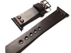 "This is my latest design of Horween Dark Brown Chromexcel leather strap. This Dark Blue leather strap is made from high quality full grain leather. The entire process is done by hand, no machines involved This band is designed for heavy duty use and sports, it has strong eyelets used to support the punch holes so it will be durable in years to come. The width and length vary. Please select the width of the strap and the length (wrist size) in the \"variations\" field. For any further customizat Handmade Adjustable Leather Watch Accessories, Handmade Adjustable Leather Watch Band, Adjustable Brown Watch With Black Band, Adjustable Leather Watch Bands With Black Band, Handmade Adjustable Brown Watch Accessories, Custom Brown Leather Watch Bands, Adjustable Distressed Brown Leather Watch Bands, Handmade Black Leather Watch Bands, Formal Black Leather Strap Watch Bands