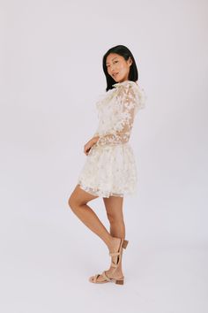 Embrace a playful and unique look with our Afternoon Limeade Dress featuring stunning floral embroidery. The long, puffy sleeves and ruffles around the neckline add a touch of whimsy to this fun and stylish piece. Perfect for a day out or a casual date night. Details Floral embroidery Long, puffy sleeves Ruffles around neckline Light green sheer overlay over off white lining Lined through bodice + skirt Zipper closure on back Sizing Approximate measurements: SIZE LENGTH BUST Small 32" 34" Medium Feminine Ruffle Dress With Lace Trim For Spring, Summer Puff Sleeve Long Dress With Ruffles, Summer Long Sleeve Puff Dress With Ruffles, Summer Long Sleeve Puff Sleeve Dress With Ruffles, Fitted Mini Dress With Lace Collar For Spring, White Lace Puff Sleeve Dress For Spring, Chic Lace Puff Sleeve Dress For Summer, Spring Long Sleeve Dress With Ruffles, Spring Lace Puff Sleeve Mini Dress