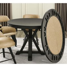 a round table with four chairs around it