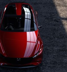 a red sports car is shown from above