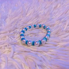 The Blue Bubble Bracelet is a clay bead bracelet that has pearls and different shades of blue shown across the clay beads. Beaded Bracelet Ideas, Bubble Bracelet, Pearl Beaded Bracelet, Clay Bead Bracelet, Clay Bead, Bracelet Blue, Bracelet Ideas, Clay Beads, Bead Bracelet