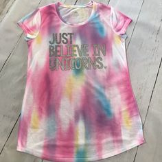 Girls Tie Dye Short Sleeve Tee Shirt From Justice. Size 18 “Just Believe In Unicorns” On Front In Glitter Brand New Without Tags. Has Never Been Worn Comes From A Smoke And Pet Free Summer Unicorn Print Crew Neck Top, Summer Crew Neck Top With Unicorn Print, Fun Multicolor Tops With Unicorn Print, Pink Letter Print Tops For Playwear, Playful Pink Tops With Rainbow Print, Unicorn Print Crew Neck Tops For Spring, Casual Unicorn Print T-shirt For Spring, Cotton T-shirt With Unicorn Print For Spring, Spring Cotton T-shirt With Unicorn Print