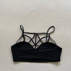 Brand New, Never Torn. Chest Has Criss Cross Pattern Black Crop Top With Underwire Straps, Black Crop Top With Adjustable Straps For Party, Black Underwire Crop Top With Straps, Black Underwire Strap Crop Top, Black Seamless Strappy Tops, Black Cropped Fitted Bra, Black Fitted Cropped Bra, Fitted Cropped Black Bra, Black Seamless Strappy Crop Top