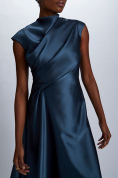 Fluid Satin relaxed drape dress with asymmetric handkerchief hem. Shown in Petrol. It is possible to have this style Made to Order in any of our standard Fluid Satin colors, please reach out to customerservice@amsale.com to place an order. Designer Couture Gowns, Formal Draped Dress, Front Drape Dress, Catherine Regehr Dresses, Chanderi Dress Designs, Edgy Formal Dresses, Silk Dress With Pleated Bodice And Draped Shape, Silk Draped Dress With Pleated Bodice, Pre-draped Asymmetrical Dress For Evening With Bias Cut