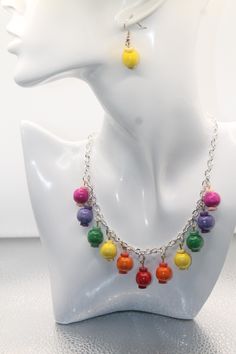 This is a beautiful handmade dangling rainbow charm necklace earring set. It has an adjustable chain to fit your size. Measures 19". Earrings are two different colors with hooks. Adjustable Multicolor Dangle Jewelry, Rainbow Round Beads Jewelry With Ear Wire, Nickel-free Rainbow Round Bead Jewelry, Nickel-free Rainbow Round Beaded Jewelry, Rainbow Sterling Silver Jewelry With Ear Wire, Multicolor Sterling Silver Necklace With Lobster Clasp, Adjustable Rainbow Jewelry With Lobster Clasp, Handmade Rainbow Dangle Earrings, Multicolor Dangling Beads Necklaces