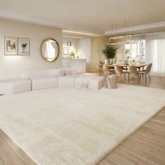 a large white rug in the middle of a living room