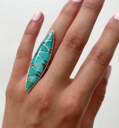 "Stunning vintage Native American Zuni sterling silver knuckle ring with 2\" flush turquoise inlay face Ring size: 5 Face height: 2\" Face width: 1/2\" Good vintage condition NOTE: Please bear that in mind that, when you purchase vintage, it might not be perfect, but it will be authentic. No returns will be accepted on vintage items so make sure that you read the description and look at the pictures before committing to a purchase. Please contact me if you have additional questions about the nat Unique Turquoise Inlay Ring, American Vintage Clothing, Face Ring, Knuckle Ring, Native Jewelry, Knuckle Rings, Blue Band, Multi Stone Ring, Ring Vintage