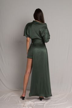 Word on the street is you want to stand out but still look chic. We’ve got you covered girl. The Fiore Dress is an asymmetrical dark sage green silk number, with a cowl neckline and ruched waist detailing. It means business on the right side and party on the left. It takes us 15 hours to make this dress. Check out the pricing transparency HERE. PLEASE ALLOW 1-3 BUSINESS DAYS FOR PRODUCTION Night Out Satin Draped Asymmetrical Dress, Satin Asymmetrical Dress For Night Out, Satin Draped Asymmetrical Dress For Night Out, Chic Evening Satin Dress With Side Slits, Chic Satin Evening Dress With Side Slits, Evening Asymmetrical Satin Silk Dress, Sleek Draped Satin Dress For Night Out, Chic Fitted Satin Dress With Draped Sleeves, Fitted Satin Asymmetrical Dress With Draped Design