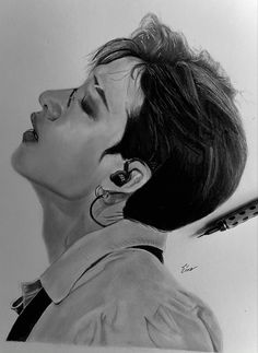 a pencil drawing of a woman with ear buds