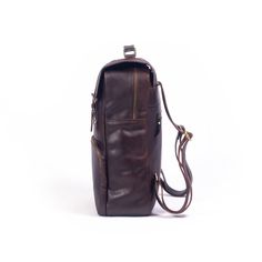 Rectangular Everyday Backpack, Rectangular Backpack With Leather Backing For Everyday Carry, Rectangular Leather-backed Backpack For Everyday Carry, Rectangular Leather-backed Everyday Backpack, Rectangular Backpack With Waxed Finish For Daily Use, Rectangular Waxed Backpack For Daily Use, Rectangular Waxed Finish Backpack For Daily Use, Brown Satchel Backpack For Gift, Brown Leather Backpack With Zipper For Everyday