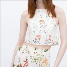 Zara Delicate Floral Off White Halter Spaghetti Strap Crop Top Size Xs Cross-Over Opening On The Back Condition: New Without Tags Approximate Measurements (Flat Lay): Pit To Pit: 15" Length: 16.5" Chic Summer Cami Halter Top, Summer Floral Print Cropped Top, Summer Floral Print Cropped Crop Top, Elegant Halter Neck Crop Top For Summer, Spring Floral Print Cropped Crop Top, Elegant Spring Camisole Halter Top, Chic Floral Print Halter Top For Day Out, White Camisole Halter Top For Summer, Fitted Halter Neck Camisole For Day Out