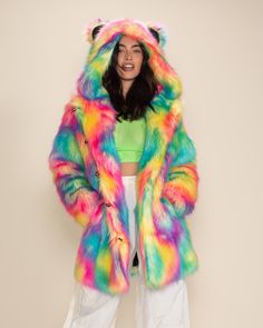 Women's Faux Fur Coat - Classic Our Colorful Faux Fur Coat for Women in Rainbow Bear, our best-selling women's festival coat, glows under UV Blacklight. Featuring custom bear buttons, an oversized hood with ears, and a secret zipper stash pocket. Catch everyone's attention when you wear this colorful faux fur to your next music festival or out prowlin' with friends. Rainbow Bear Characteristics PLAYFUL • POSITIVE • SOCIALDo you have the Spirit of the Rainbow Bear? If you do, you’re known for you Colorful Faux Fur Coat, Festival Coats, Womens Faux Fur Coat, Coat Classic, Bear Face, Neon Rainbow, Fur Coats Women, Endangered Animals, Classic Coats