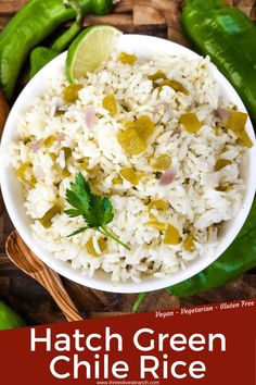 hatch green chile rice in a white bowl with limes and jalapenos on the side