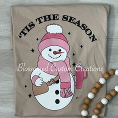 Tis the Season Snowman available in T-shirt or a Crewneck Sweater  Product Description Made to order Unisex Adult tee This Design will be made with screen printing  Unisex t shirt fits like a well-loved favorite, featuring a crew neck, short sleeves ❤GARMENT FEATURES ❤ * Uniquely soft and comfortable ringspun/pre-shrunk Bella & Canvas shirt * Solid colors: 100% Preshrunk Cotton, Heather Colors: 52% Cotton / 48% Poly(except Athletic Heather with %90 cotton %10 polyester) * Uniquely soft and comfo Snowman Tshirts, Winter Crew Neck Pre-shrunk T-shirt, Sweater Tshirt, Pink Cups, Gildan Sweatshirts, Tis The Season, Bella Canvas, Crew Neck Sweater, Screen Printing