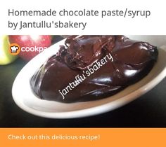 there is a chocolate pastry on the plate with an apple in the background and text that reads homemade chocolate paste / syrup by jantu's bakery