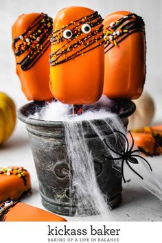 halloween treats made to look like pumpkins with googly eyes