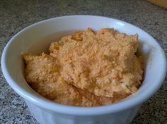 a white bowl filled with food on top of a table