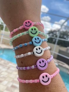 Hand-made in sunny Florida! The goal of these colorful bracelets is to make you smile and brighten your day when you look at them! Surprise your daughter, friend, Mom, etc. with this feel good bracelet! It comes in the following colors - purple, green, blue, pink (light pink smiley or dark pink smiley), & white. Smiley Face Bracelets, Fun Blue Bracelets For Gifts, Cute Blue Stretch Bracelet For Birthday, Playful Blue Beaded Bracelets For Birthday, Playful Blue Friendship Bracelets With Colorful Beads, Playful Adjustable Blue Friendship Bracelets, Cheerful Adjustable Friendship Bracelets As Gift, Blue Casual Stretch Bracelet For Festivals, Casual Blue Stretch Bracelet For Festival