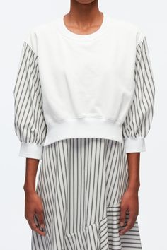 PS24 | A fusion of styles, this striped dress borrows elements from athleisure, shirting and eveningwear. It features a sweatshirt contrasted with a classic cotton-poplin back and flares out to a fluid handkerchief hem. Striped Crew neck Three-quarter length puff sleeves Elasticated trims Asymmetric handkerchief hem Spring Cotton Sweatshirt With Contrast Stripes, Spring Daywear Tops With Contrast Stripes, White Contrast Stripes Sweatshirt For Spring, White Spring Sweatshirt With Contrast Stripes, Spring White Sweatshirt With Contrast Stripes, White Sweatshirt With Contrast Stripes For Spring, Knit Swimwear, Combo Dress, Perfect Pant