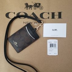 Coach Signature Brown Black Lanyard Id Card Badge Holder Case Wallet F63274 Not Excepting Offer On This Lanyard. Lowest Price On Pm.. Crafted In Our Signature Jacquard, This Lanyard Features An Id Window, Plus Two Card Slots At The Back. Wear It Around The Neck Or Detach The Strap And Tuck It Into A Bag. Signature Coated Canvas With Leather Details Two Credit Card Slots Id Window Dimensions: 2 3/4" (L) X 4" (H) Coach Id Holder, Coach Lanyard, Window Dimensions, Black Lanyard, Id Lanyard, School Id, Bath Body Works Candles, Coach Accessories, Badge Holder