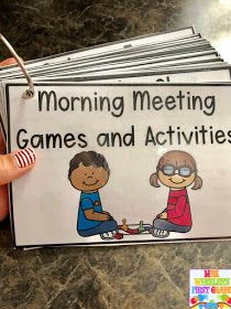 a person holding up some cards with the words morning meeting games and activities on them