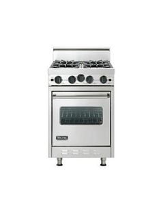 a silver stove top oven sitting next to a white wall