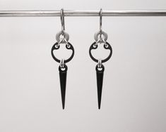 I made these industrial earrings with steel retaining rings, stainless steel washers, and black acrylic spikes. They are made of hardware which is kind of fun and edgy, but they have a chic look to them as well. These earrings can be worn with anything. They are 2 inches (5 cm) long from the top of the ear wires, and the washers are just under 1/2 an inch (1.3 cm) wide. These earrings are on the small side, they are narrow and sleek. I have more spike earrings listed here: https://www.etsy.com/s Black Edgy Sterling Silver Earrings, Edgy Black Sterling Silver Earrings, Edgy Black Stainless Steel Earrings, Black Sterling Silver Edgy Earrings, Nickel-free Black Metal Plug Earrings, Black Metal Edgy Plug Earrings, Edgy Surgical Steel Earrings, Black Surgical Steel Pierced Earrings, Black Nickel-free Surgical Steel Earrings