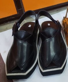 Hand Stitched high quality leather Kaptan Peshawari chappal made from the finest leather and Materials to provide wearer the best comfort. Experienced craftsman to deliver you not only the product a finest state of the art Chappal to give your personality an Elegant look. Material: Leather Sole: Highest quality tire rubber Product Colors: Yellow (Golden) , Black, brown, Dark Brown, Geans Color, gray Polish: Yes washable and ploish Size: 7 to 12 Shape: Shape through hand stitching without using k Leather Sandals With Dabka And Round Toe, Traditional Closed Toe Sandals With Leather Lining, Traditional Leather Open Toe Shoes, Pakistan Photos, Gray Polish, Tail Dress, Imran Khan, A Perfect Day, Blue Sandals