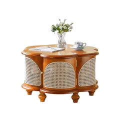 a wooden table topped with a vase filled with flowers