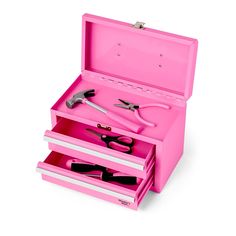 a pink tool box with scissors and other tools in it on a white background,