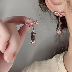 Description:Chic Pink Crystal Heart Dangling Ribbon Cat Earrings Specifications:Material: crystal. cubic zirconia. copper. enamelColors: BlackSize: 1.37 inches * 0.6 inchesWeight: 5.8 g/pair Features & Details:Material: These Chic Pink... Heart Ribbon, Ribbon Design, Cat Earrings, Sparkling Crystal, Cubic Zirconia, Gifts For Her