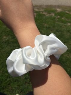 Hi beauty! I present to you my handcrafted scrunchies! There are five beautiful colours to choose from. Each scrunchy can wrap around hair about 2 to 3 times - even around luscious thick hair! Any pulling and tugging from regular hair elastics will be a thing of the past. My soft satin scrunchies are sure to be gentle on your gorgeous hair!  Fabric: Satin  Available colours: White, champagne pink, black, lavender, and silver green Materials: Elastic band, satin fabric Satin Hair Wrap, Big Scrunchies, Rose Champagne, Satin Scrunchies, Hair Elastics, Ribbon Slides, Gorgeous Hair, Hair Accessories Headbands, Bridesmaid Gift