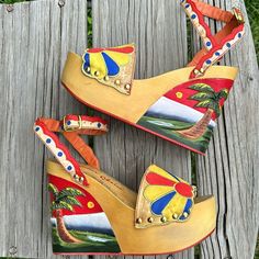 Wow! These Rare Beauties Are A Work Of Art, They Should Be Framed For A Museum! Carved Wooden Platforms With A 3-Dimensional Beach Scene, Sunny Satin Pieced And Embroidered Uppers, And Delicate Ankle Straps. By Famed Cobblers, Irregular Choice. Very 40s Betty Grable. These Stole My Heart In 2010, And I Wore Them Once, Possibly Twice; They Are Very Tall And Very Flashy, And I Have Started Feeling A Bit Unsteady In Shoes This High. There Are A Few Tiny Spots Photoed On The Straps, But Overall Amaz Vintage Sandals For Summer Beach, Vintage Sandals For Summer Beach Outings, Vintage Sandals For Beach In Summer, Retro Open Toe Sandals For Beach, Retro Closed Toe Sandals For Beach, Retro Open Toe Wedge Sandals For Beach, Retro Platform Beach Sandals, Vintage Ankle Strap Wedge Sandals For Summer, Vintage Summer Wedge Sandals For Beach