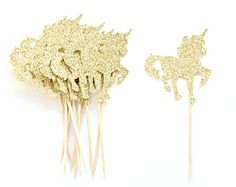 gold glitter unicorn cake toppers on sticks