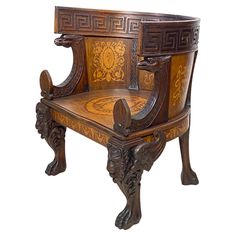 an ornate wooden chair with carvings on the back