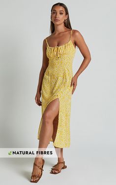 Get ready to turn heads in the Willa Midi Dress - Ruched Bust Thigh Split Dress In Yellow Floral! This stunning yellow dress features a charming sweetheart neckline and a figure-flattering fitted silhouette that is perfect for any occasion. With its sleeveless design and comfortable cotton fabric, this slip dress is not only stylish but also incredibly easy to wear. The thigh-high split adds an extra touch of sass, while the midi length keeps it classy. Whether you're going for a casual day look Yellow Fitted Dress With Sweetheart Neckline, Fitted Sundress With Ruched Bodice And Sweetheart Neckline, Yellow Summer Dress With Sweetheart Neckline, Yellow Dress With Sweetheart Neckline And Fitted Bodice, Yellow Dress With Sweetheart Neckline For Brunch, Yellow Midi-length Dress With Fitted Bodice, Yellow Midi Dress With Fitted Bodice, Yellow Fitted Midi Dress With Spaghetti Straps, Yellow Fitted Bodice Midi Dress