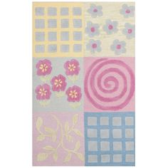 a multicolored rug with flowers and squares on the side, in pastel colors