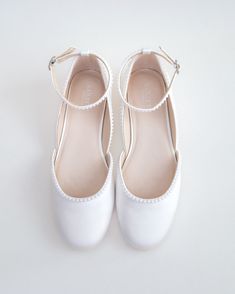 Inspired by a contemporary and refined ballet style flat. Classic silky satin round toe flat with added mini pearls details brings an elevated elegance. The delicate mini pearl beads are placed carefully by hand to create a graceful classic bridal shoe. Perfect for fall or summer wedding, evening wear, holiday, or romantic date.DETAILS:UPPER: Synthetic upper and liningMATERIALS: Manmade outsoleImported Materials Wedding Dress And Flats, Pearl Ballet Flats, Prom Shoes Flat, Bridal Flats Shoes, Flat Wedding Shoes For Bride, Bride Shoes Flats, Wedding Flat Shoes, Wedding Flats For Bride, Flat Prom Shoes