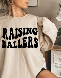 Basketball Mom Aesthetic, Crew Neck Slogan T-shirt For Fall, Band Merch Crew Neck Top With Slogan, Slogan Crew Neck Top For Fans, Comfortable Crew Tops With Letter Print, Fan Apparel Slogan Crew Neck Top, Fan Apparel Slogan Top, Oversized Crew Neck Tops With Lettering, Comfortable-fit Letter Print Crew Tops