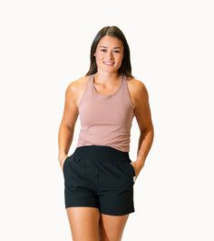 Your fave tank top has arrived! This trendy top can be paired with leggings or shorts for your everyday athleisure look or pair it with some jean shorts and throw on a jacket for everyday casual wear. However you style it you'll look fabulous! With a built in bra and 4-way stretch it's just as comfy as it is stylish. Sporty Short Tops For Gym, Athleisure Tops For Gym With Short Length, Athleisure Tops For Gym In Short Length, Short Length Athleisure Tops For Gym, Athleisure Tops For The Gym, Athleisure Tank Top With Built-in Shorts For Workout, Cotton Tops With Built-in Shorts For Sports, Casual Moisture-wicking Short Top, Spring Yoga Tops In Short Length