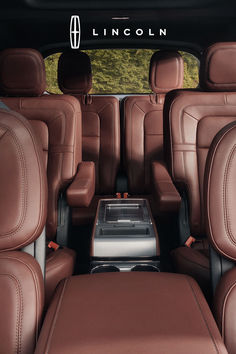 the interior of a car with brown leather seats