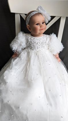 Luxury Couture Heirloom handmade christening gown is truly stunning. This amazing christening gown is milky white in color, featuring charming ruffled tulle sleeves, a pearl beaded tulle skirt with scalloped edging, a delicate gorgeous lace bodice, with a charming matching headband. Seams are locked and reversed inside out which ensures it does not touch baby's skin at all and that means she won't be itchy. Fabric Type: Pearl Beaded Lace/Tulle/Satin/Cotton Length: Traditional 38"-40" Dress is ma Tulle Gown With Ruffles For Baptism, Ruffled Tulle Gown For Baptism, White Tulle Gown With Pearl Embroidery, White Tulle Baptism Dress For Ceremony, White Tulle Gown For Baptism, Organza Baptism Gown With Ruffles, 40 Dress, Tulle Sleeves, Beaded Tulle