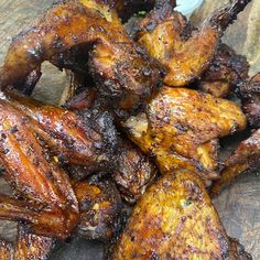 some chicken wings sitting on top of a cutting board