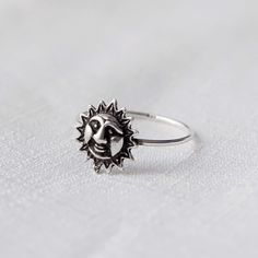 Real 925 Sterling Silver Sun Face Ring Ring Face Measures 11mm Ring Band Thickness measures 1mm Jewelry will come in a gift box * Please read shop policy before placing an order * *JEWELRY CARE* Sterling Silver will tarnish over time, but to help keep your jewelry looking beautiful - Clean with a soft dry cloth after wear and store inside an airtight bag or container. Remember to remove your jewelry when: * Applying lotion or sunscreen * Applying perfume * Taking a shower / bath * Working out Sun Design Jewelry Promise Ring, Sterling Silver Sun Design Ring, Silver Sterling Sun Design Ring, Sterling Silver Rings With Sun Design, Sterling Silver Ring With Sun Design, Sterling Silver Sun Design Ring For Gift, Sterling Silver Ring With Sun Design For Gift, Applying Perfume, Eye Ring Silver