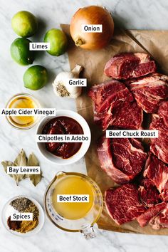 the ingredients to make an apple cider vinegar beef roast recipe on a cutting board